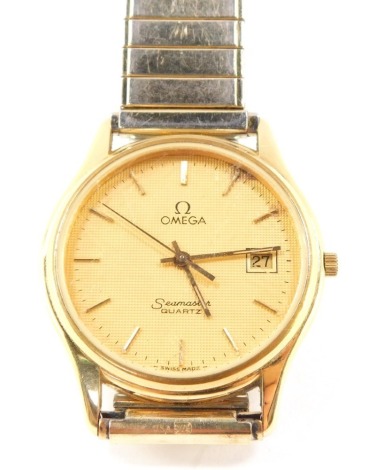 An Omega Seamaster gentleman's gold plated wristwatch, circular dial with centre seconds, date aperture, Quartz movement, No 1430, on a plated bracelet strap.