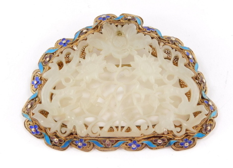 A Chinese white jade silver filigree and champleve enamel pendant brooch, carved and pierced with flowers, in a frame decorated with a repeating band of flowers and scrolls, 38.5g,.