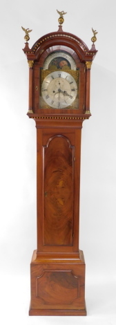 Lewis Poignand, a George III Channel Islands mahogany long case clock, the break arch dial with painted moon phase and plate detailing high water at Jersey, dial with foliate scroll spandrels, silvered chapter ring bearing Roman numerals, subsidiary secon