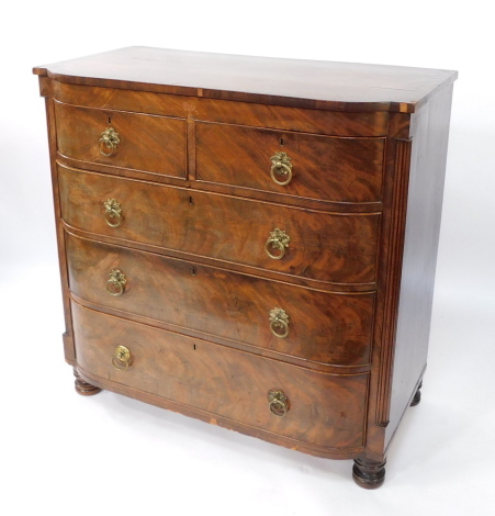 A late Georgian flame mahogany bow front chest of two short over three long graduated drawers, raised on turned feet, 100cm high, 101cm wide, 55cm deep.