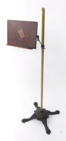 A Victorian brass cast iron and wooden reading stand, by White and Wright of Liverpool, 118cm high.