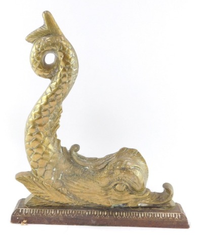 A Victorian brass and cast iron door stop, cast as a dolphin, 21cm high, 26cm wide.