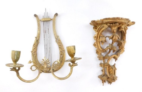 A Chinese Chippendale style gilt wood wall shelf, 22cm high, together with a brass lyre shaped twin branch candle wall light, 27cm high. (2)