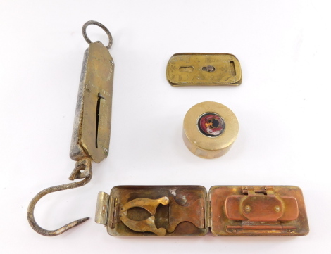 A brass portable tong heater, brass implement stipple engraved JNO Waters, 1759., brass and enamel circular paperweight, and a set of Salter's Improved spring balance scales, No 2. (4)