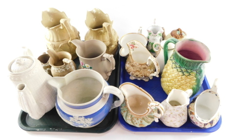 English early 19thC and later porcelain cream jugs, stoneware relief moulded jugs, coffee pot, majolica teapot, and jugs, etc. (a quantity)