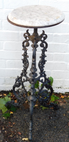 A Coalbrookdale style cast iron and marble topped garden table, 80cm high.