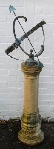 A brass armillary sundial, raised on a concrete column base, 140cm high.