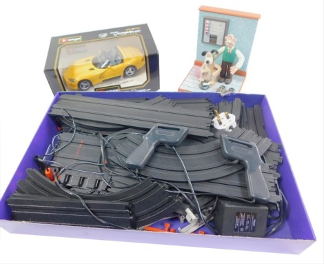 A Burago die cast model of a Dodge Viper, RT/10, scale 1:18, 3065, boxed, together with Scalextric and a Wesco Wallace & Grommett alarm clock. (3)