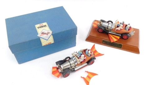 A Corgi die cast model of Chitty Chitty Bang Bang, together with a later model, 25th Anniversary 1967-1992, on a wooden base. (2)