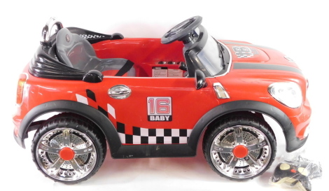 A Classic 16 Baby Remote Controlled Electric Pedal Mini Cooper Car, in red, with control.