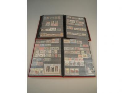 Forty Four stamp albums with loose stamps