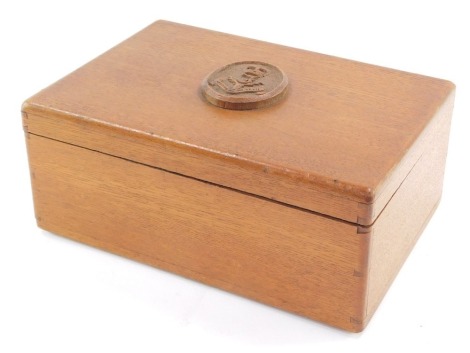 A carved wooden box with Scottish Regimental carving to top, label under Made By Men Of The Royal Naval Division Interned In Holland, Groningen 1915.