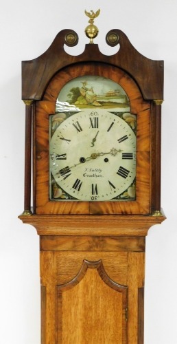 J. Saltby of Grantham. A 19thC oak and mahogany longcase clock, with swan pediment hood with bulbous and eagle brass applicator, above two column supports on a single trunk door, on stepped feet, eight day movement with a painted cream dial depicting Orie