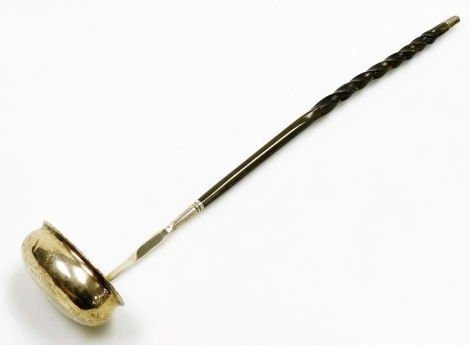 A crested toddy ladle, with twisted whale bone handle, bears no marks, 34.5cm long.