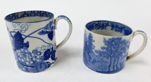 A large 19thC Pearlware mug, with blue and white transfer landscape and figure decoration, 9cm high, and another with transfer decoration of thorns and fruit, 11.5cm high. (AF, 2)