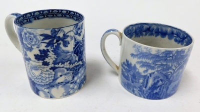 A large 19thC Pearlware mug, with blue and white transfer landscape and figure decoration, 9cm high, and another with transfer decoration of thorns and fruit, 11.5cm high. (AF, 2) - 2