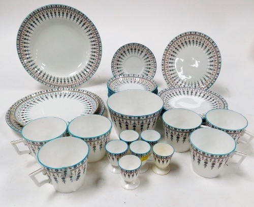 A Crown Derby part tea service, with blue borders and flowers in the drop pattern, circa 1880, comprising six cups and saucers, six side plates, two dinner plates, serving plate, bowl and six egg cups.