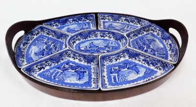 A Booths Old Blue Danube hors d'oeuvres dish, with blue and white design of ships in an outer wooden slip tray, 42cm x 41cm.