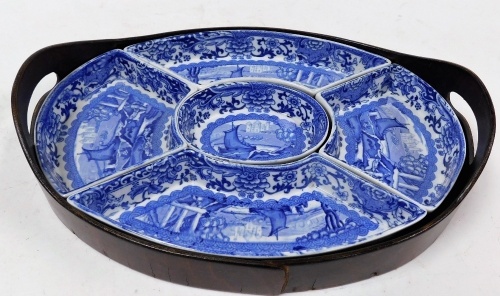 A Booths Old Blue Danube pattern hors d'oeuvres dish, with central oval bowl and four outer sections in blue and white design with ships, with wooden slip tray, 31cm x 23cm.