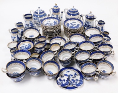 A Booths Real Old Willow pattern part service, comprising coffee pots, teapots, graduated milk jugs, teapot stand, cups and saucers, coffee cans and saucers, bowls, etc. (4 trays)