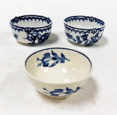 Three Booths finger bowls, to include a pair of blue and white floral finger bowls, 7cm wide, and a earlier example with lily 7cm wide. (3)