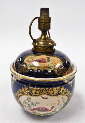 A Booths porcelain table lamp, in royal blue ground with gilt detailing with Asiatic pheasant and leaf design, with bowl and brass converted top to electricity, 32cm high. (AF)