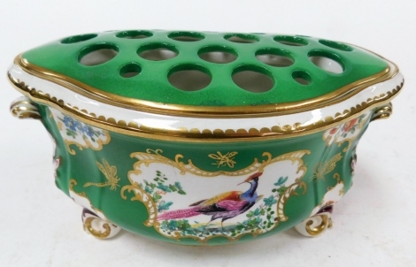 A Booths Silicon china bough pot, on a green ground with gilt decoration with Asiatic pheasants and flowers, with shell scroll feet and set top, 10cm high, 20cm wide.