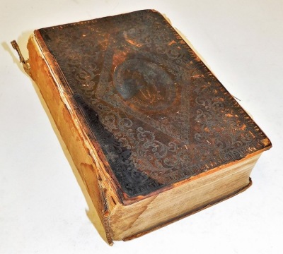 A 19thC leather bound Holy Bible, with inscription dated 1835, with a Christian motto crest to exterior. (AF)