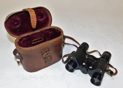 A set of Deltrex Minim binoculars, 6x24 in small brown leather carry case.