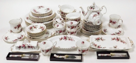 A Royal Albert Lavender Rose pattern part tea and dinner service, comprising dinner plates, side plates, bread plates, teapot, sugar bowls, butter dish bowls, cups, saucers, cake knife, etc. (3 trays)