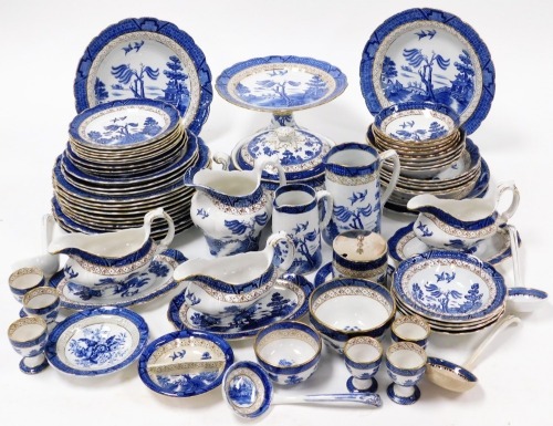 A group of Booths Real Old Willow pattern part dinner wares, to include cake plate, gravy boat and stand, ladles, bowls, jugs, dinner plates, etc. (3 trays and a quantity)