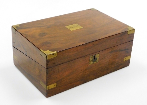 A Victorian walnut writing box, with brass detailing, opening to reveal a black leather inset writing slope with two cut glass and silver plated ink wells, 35cm wide, 15cm high, 23cm deep.