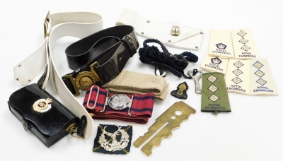 A group of Royal Engineers badges, belts and arm straps, to include a Royal Engineers carry case, belt, Highlands badge, belt, etc. (a quantity)