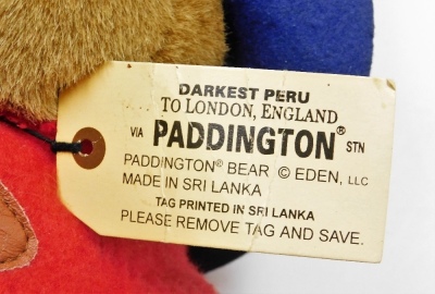 A Paddington Bear, with blue hat and red duffel coat with black wellingtons, 35cm high. - 3