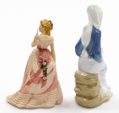 Two porcelain figures, to include a Lladro figure of a lady sat on rocks with lilies, 24cm high and a Wedgwood enchanted evening gallery of English costume figure of a lady, 21cm high. (2) - 2