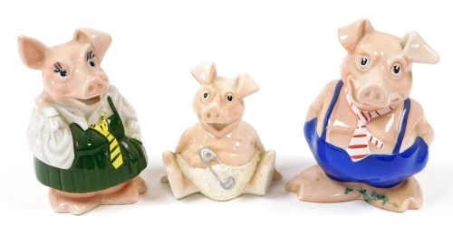 Three Natwest piggy banks, lacking stoppers, two stamped Wade.