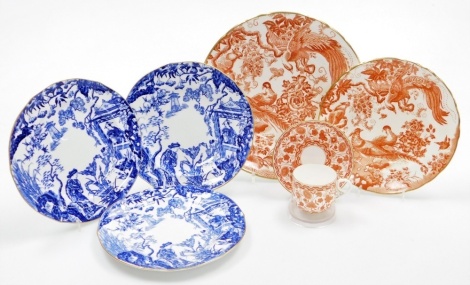 A group of Royal Crown Derby plates, three decorated in blue and white design with Chinese decoration, each with a green/blue stamp to reverse, and numbered VI, 21cm diameter, two red Aves plates, 27cm diameter and 21cm diameter, together with a Royal Dou