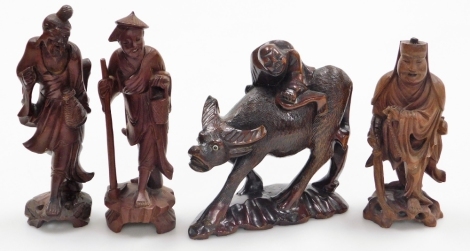 A group of four Chinese hardwood figures.