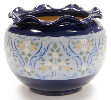 A Doulton Lambeth planter, with flared rim on royal blue body with floral banded decoration, 21cm high.