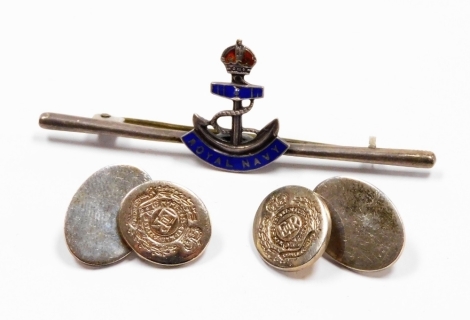 A pair of silver cufflinks, each with oval crest and bearing the Royal Fusilier's crest, together with a silver Royal Navy and enamel stick pin, 14g all in. (2)