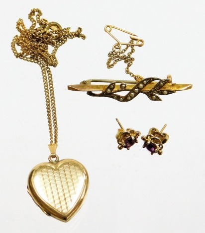 A 9ct gold bar brooch, with seed pearl spray and safety chain, a pair of amethyst set 9ct gold studs, 3.1g all in, together with a gold plated heart shaped locket and chain.