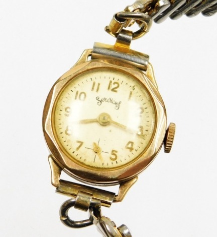 A Servis 9ct gold cased ladies wristwatch, on a later expanding stainless steel strap, 20.3g all in.