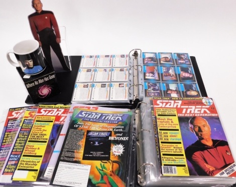 A group of Star Trek memorabilia, to include James Kirk and Spock mug, the Star Trek Next Generation collectors cards in collectors card album, and Star Trek Next Generation collectors portfolio with various magazines. (2 folders and 1 mug)