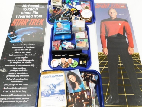 A group of Star Trek Memorabilia, to include a Star Trek Next Generation Make It So sign, miniature ships, badges, collectors pins, collectors cards, millennium guide, coloured photographs, etc. (3 trays and a quantity)