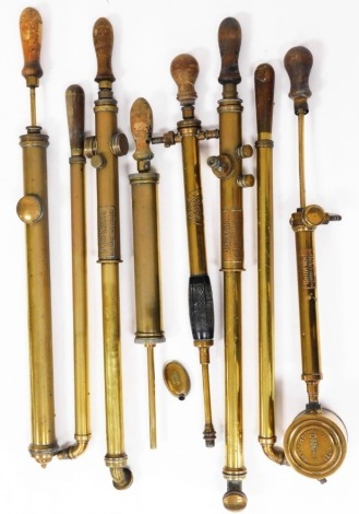 A group of brass garden syringes, etc. (a quantity)