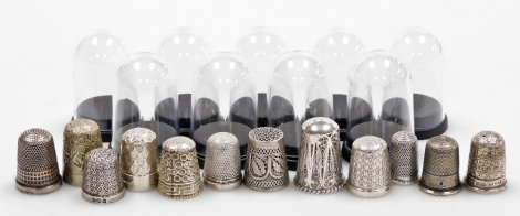 A group of twelve silver thimbles, each of varying design, some in thimble cases, many by Charles Horner and others, 3½oz.