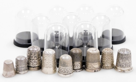 A group of nine silver thimbles, each of varying design, some in thimble cases, many by Charles Horner and others, 3oz.