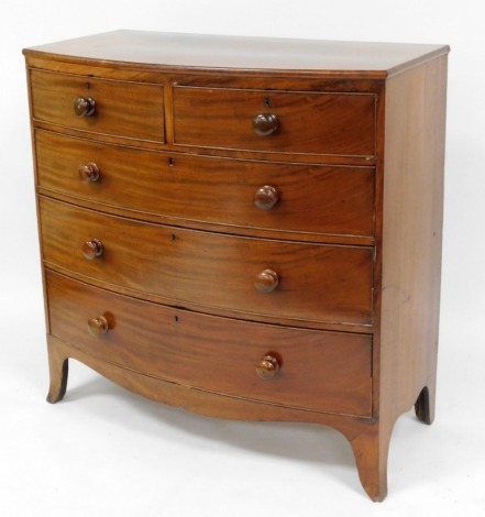 A 19thC mahogany bow front chest of drawers, with two short and three long drawers on bun handles with splay legs, 105cm high, 104cm wide, 52cm deep.