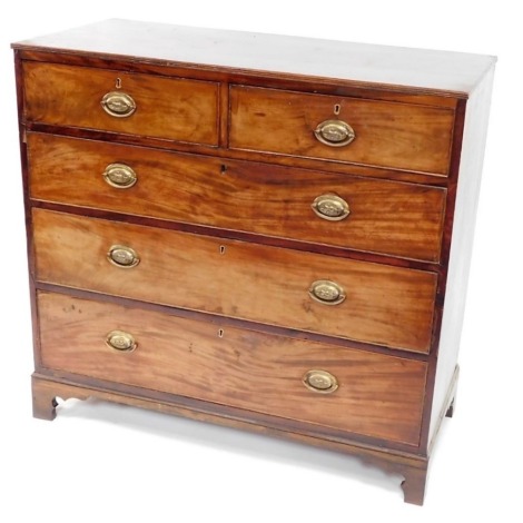 A George III mahogany chest of drawers, with a moulded edge, above two short and three long drawers, each with oval pressed brass handles, on bracket feet, 102cm high, 108cm wide, 50cm deep.