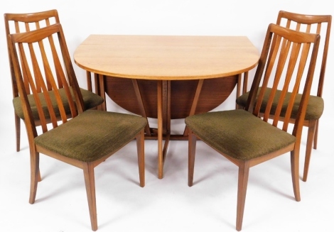 A G-Plan teak drop leaf dining table and four associated dining chairs, the table 73cm high, 106cm wide, 30cm deep when closed.